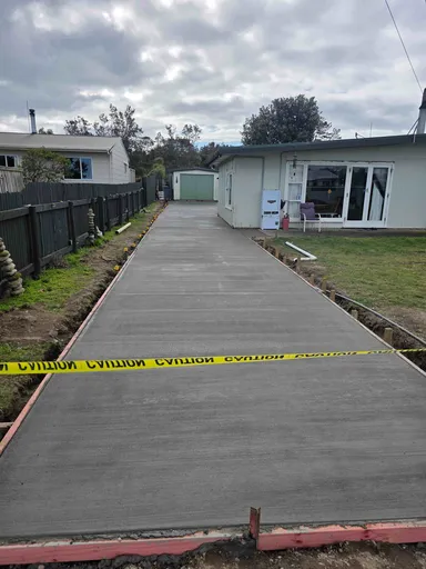 Newly poured residential concrete driveway managed by Howe Civil Manawatu.